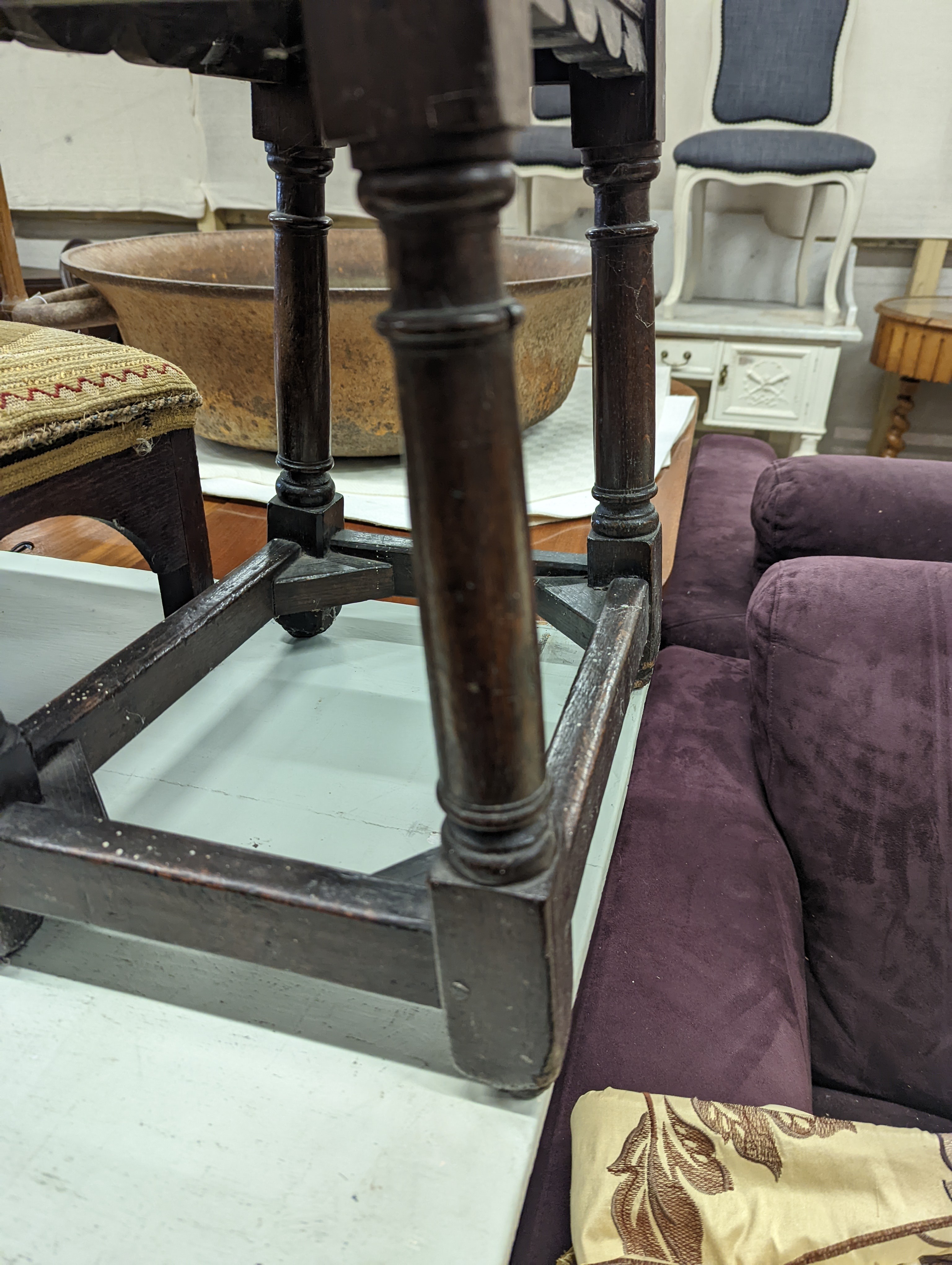 A 17th century style oak joint stool, width 46cm, depth 26cm, height 46cm and a George III stool with Victorian needlework seat, length 33cm